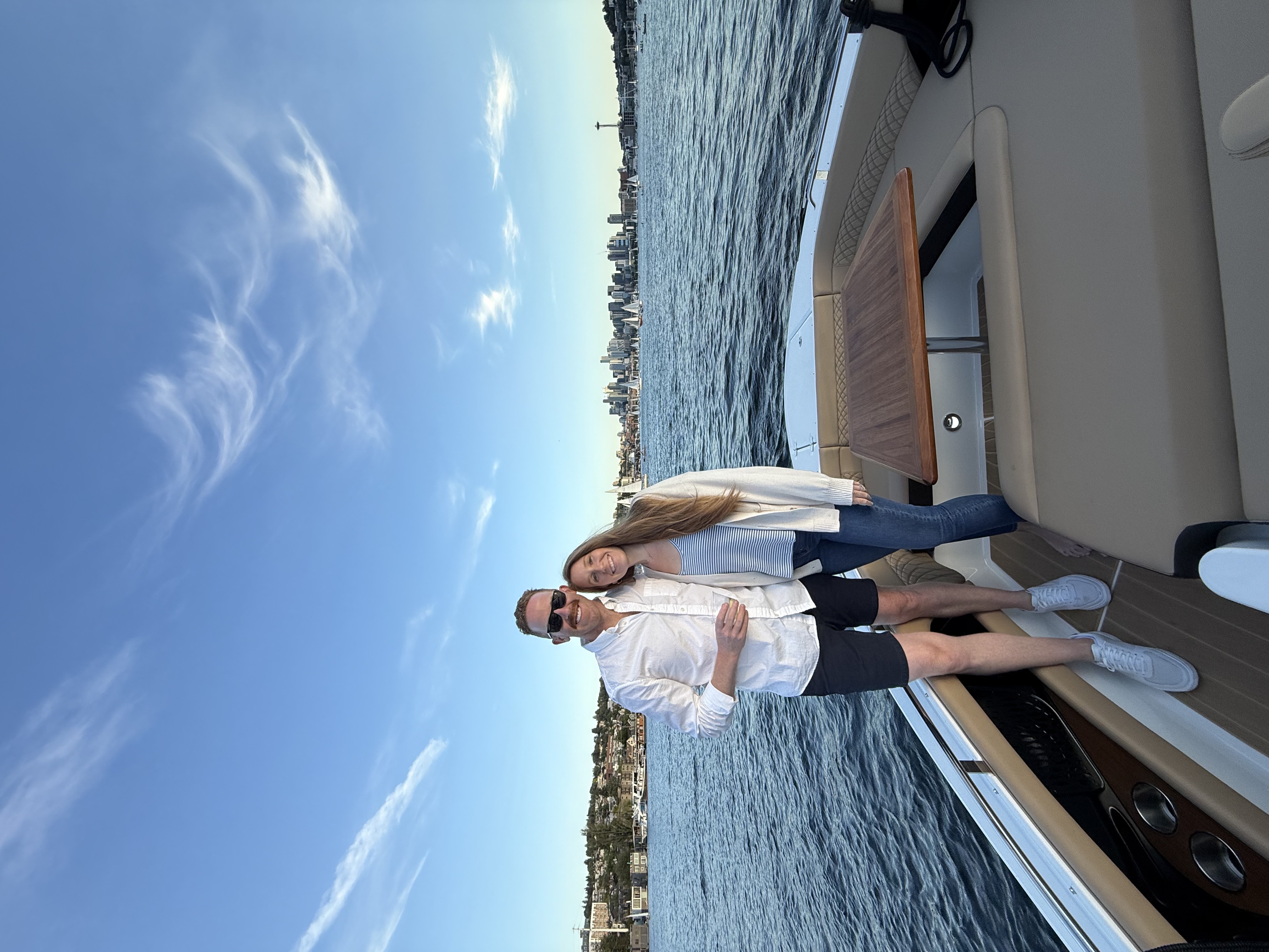Guests enjoying the boat with Seattle skyline