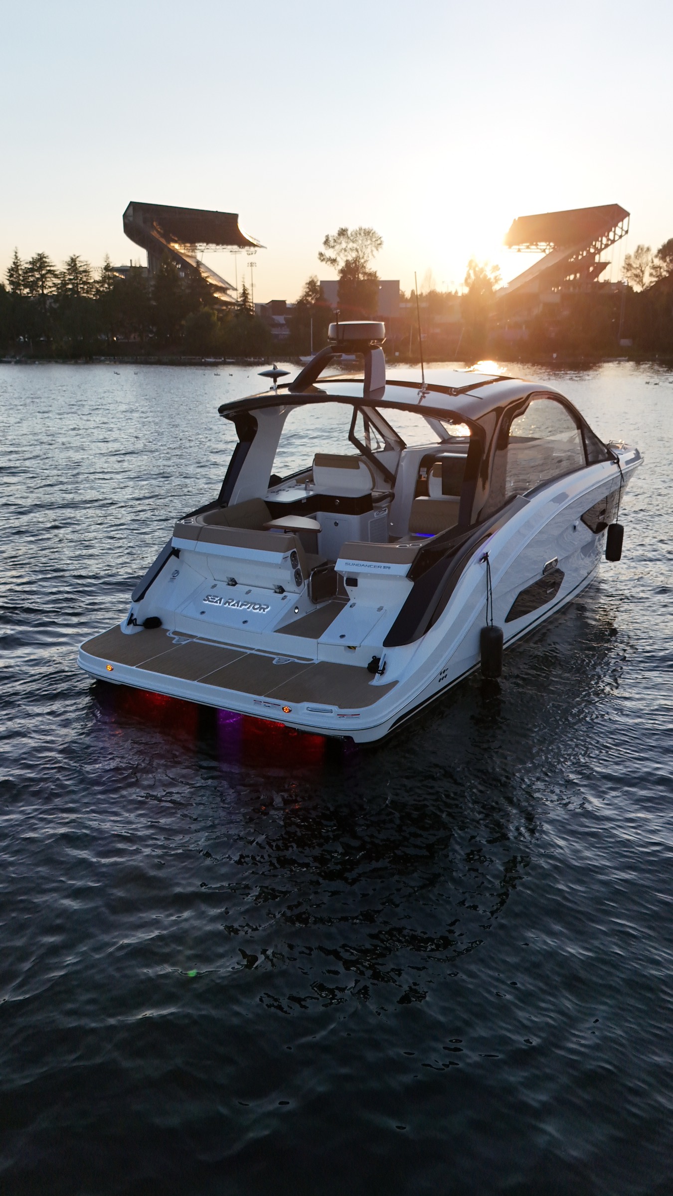 Sea Raptor at golden hour on Lake Washington with Husky Stadium and the setting sun behind