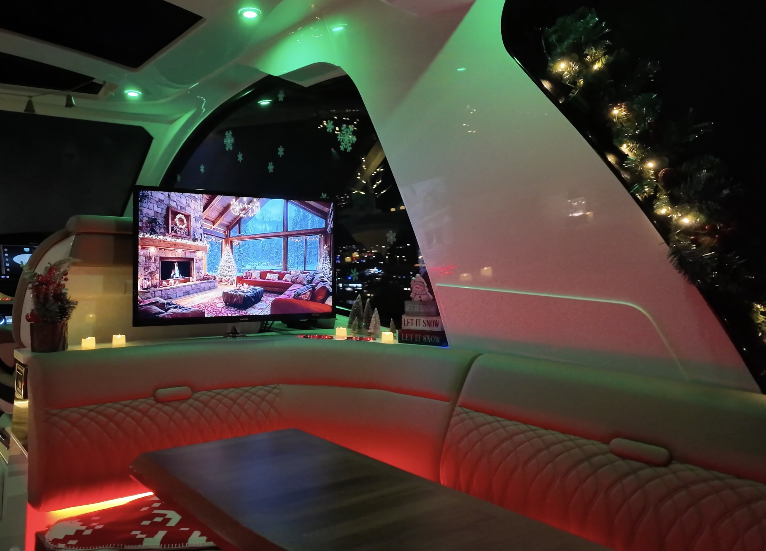 Winter cockpit setup with TV, holiday lights, and Christmas decor
