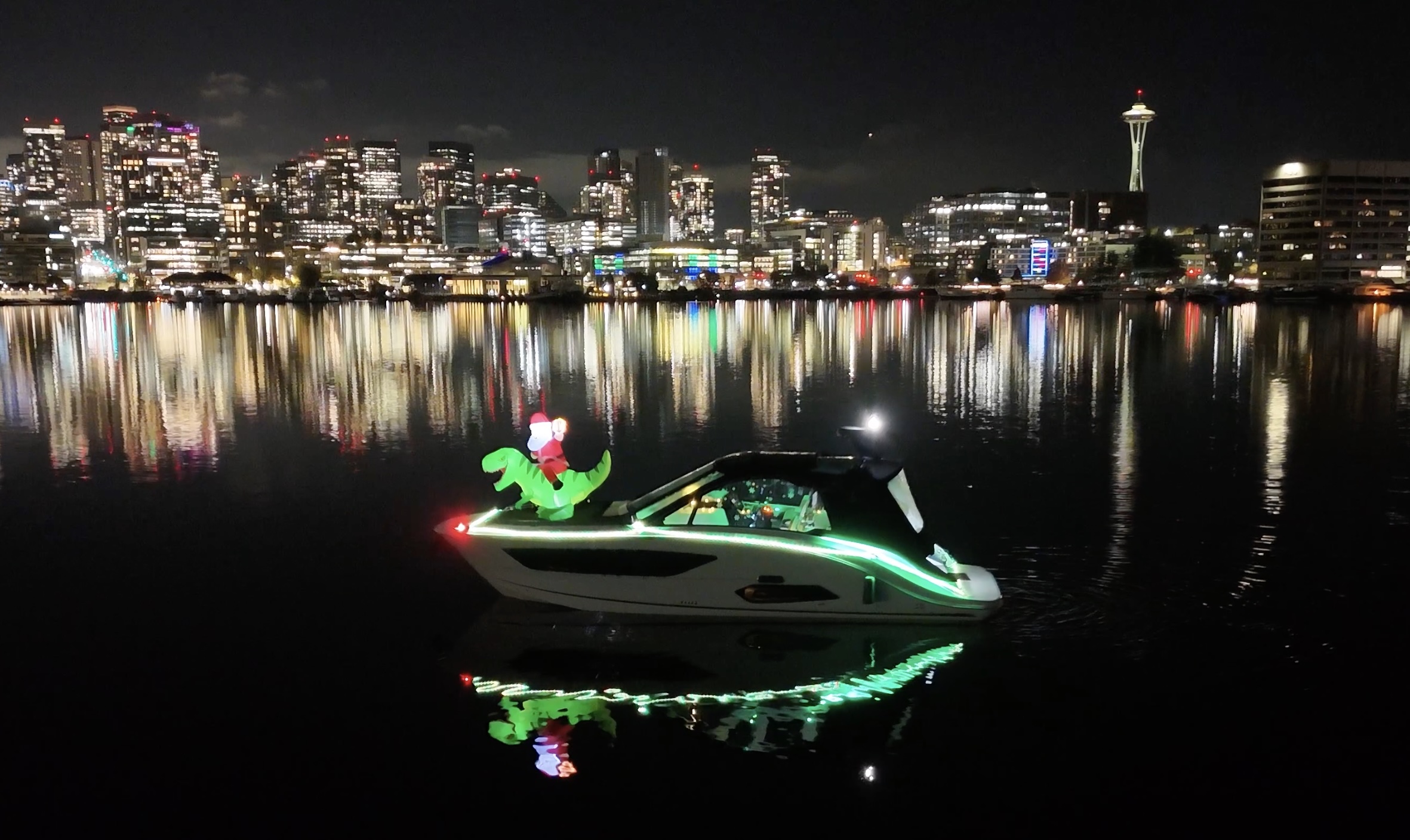 Sea Raptor drone shot with Seattle skyline at night